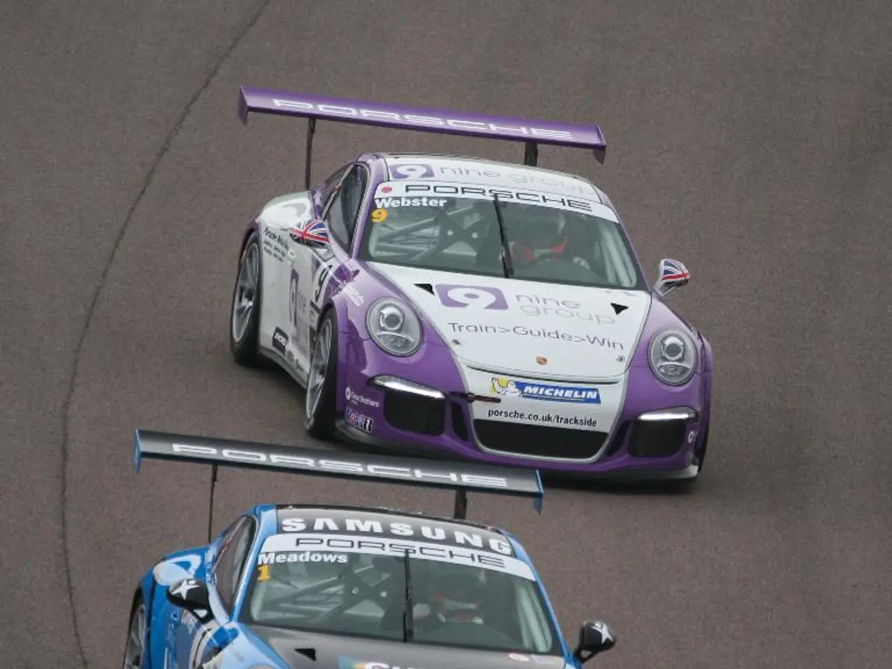 This picture is clicked outside the city. In the center we can see the two cars running on the...