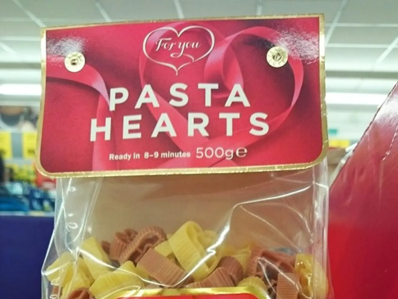 In this image in the front there is a box with some text written on it and there is a packet with...