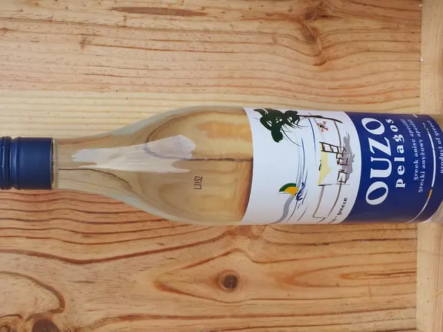 This bottle is highlighted in this picture. It has a blue cap.