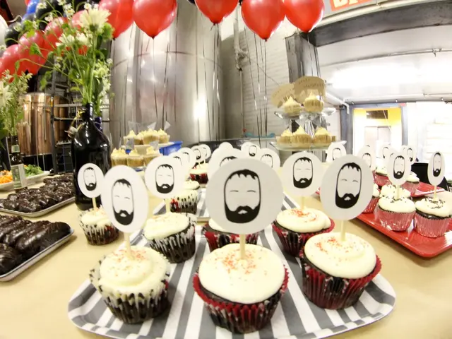 In this image there is a table, on which we can see there are so many cup cakes in the tray and...