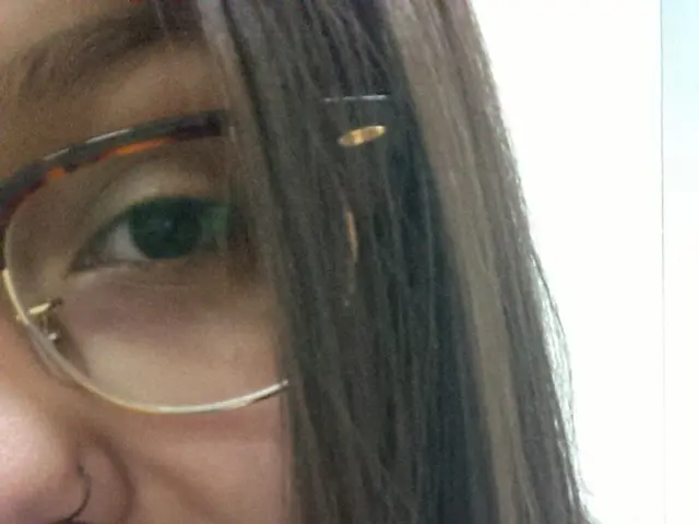 In this image we can see a person and the person is wearing the spectacles.