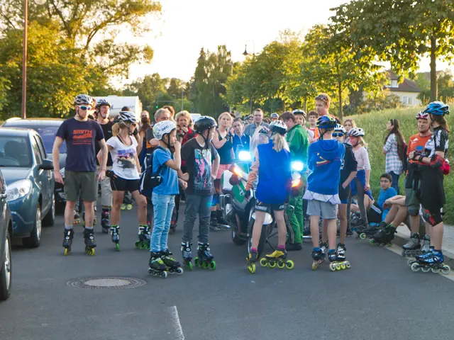 In this image there is a motor bike and there are group of people with helmets and skating shoes...
