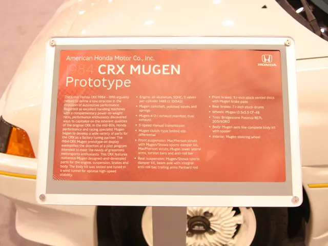 In the picture there is a board with the text, beside the board there is a vehicle present on the...