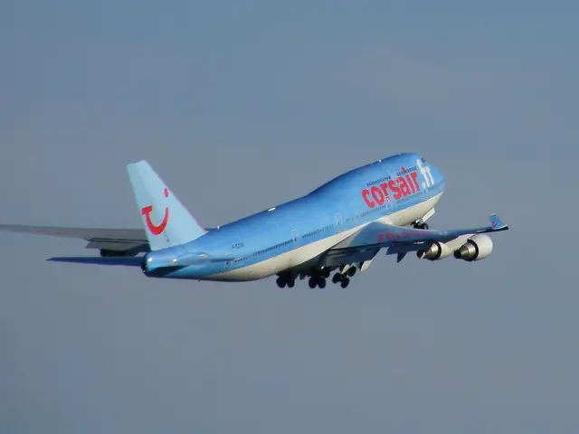 Plane is flying in the air. These are wings. Background we can see the sky. Sky is in blue color.