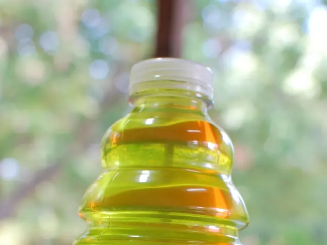 This picture consist of a bottle with the name MVP2 low calorie which is on the table. In the...