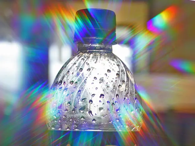 This is a wooden table where a coca cola bottle is kept on it.